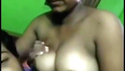 Hot brunette with huge boobs showing off her sexy body