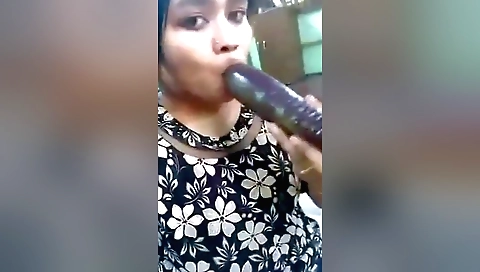 Indian brunette plays with her favorite toys in solo