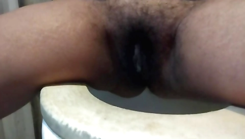 Indian hairy girl is stretching wet and hairy pussy