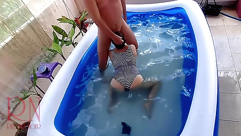 Regina noir swims in the pool and fumbles her pussy