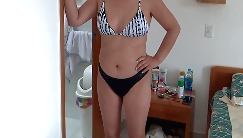 Hot amateur pornstar is wearing her bikini and taking a shower