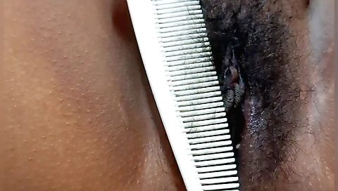 Indian naked woman rubs her hairy pussy and plays with it