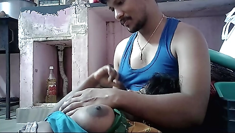 Hot brunette in sexy outfit stretching out her natural tits