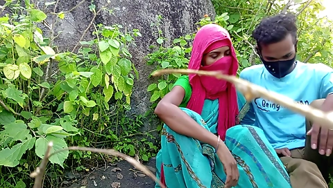 Girl in a red outfit in forest outside the village area