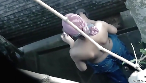 Indian girl in a bikini wetting her pussy in the pool